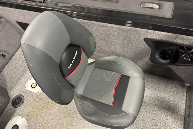 Slide: The Image of 2024 Tracker Targa V-18 Combo boat seat with gray upholstery and red accents. - 8