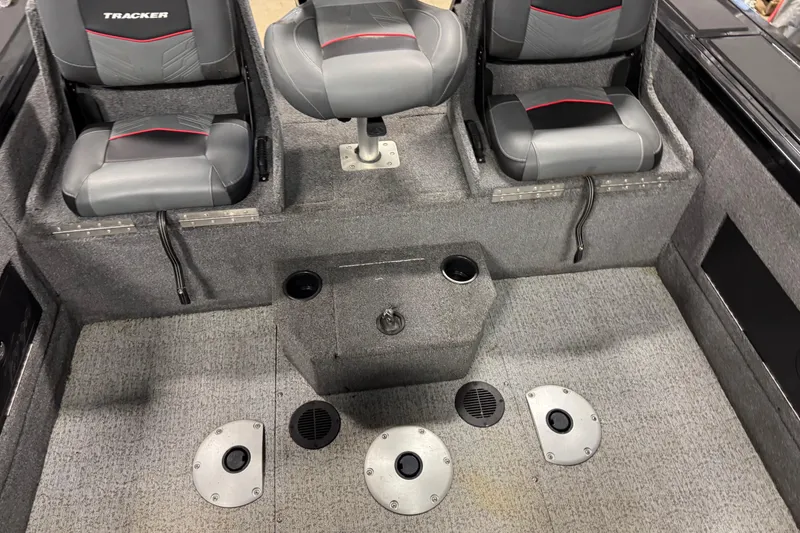 Slide: The Image of 2024 Tracker Targa V-18 Combo boat interior with seating and storage compartments. - 9