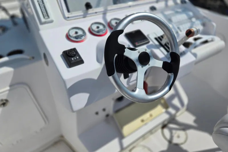Slide: The Image of Steering wheel and dashboard of a 2007 Donzi 35 ZF Daytona boat. - 15