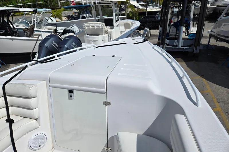 Slide: The Image of 2007 Donzi 35 ZF Daytona boat with Yamaha engines, docked in a marina. - 18