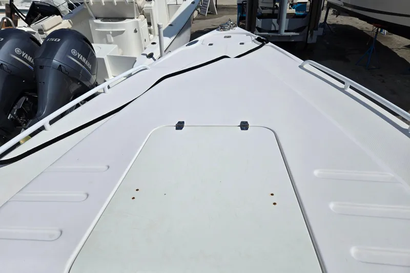Slide: The Image of 2007 Donzi 35 ZF Daytona boat deck with Yamaha engines in marina. - 21