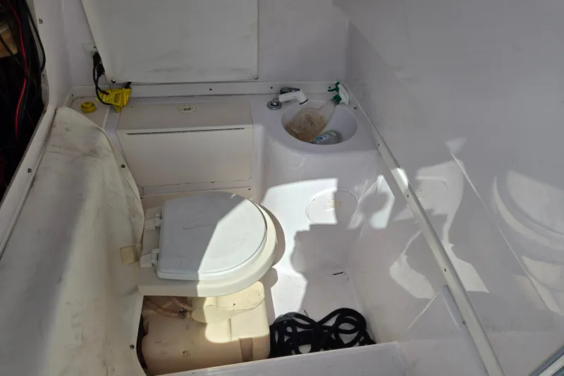 Slide: The Image of 2007 Donzi 35 ZF Daytona boat interior with toilet and sink. - 22