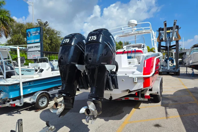 Slide: The Image of 2007 Donzi 35 ZF Daytona boat with twin 275 horsepower engines at a marina. - 8