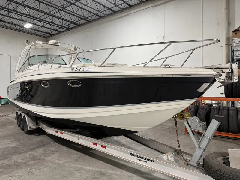 The Image of 2005 Formula 370 Super Sport boat on trailer in warehouse. - 0