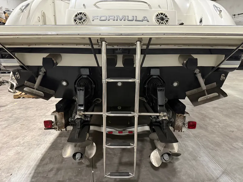 Slide: The Image of Rear view of a 2005 Formula 370 Super Sport boat with ladder. - 10