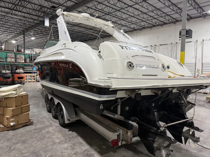 Slide: The Image of 2005 Formula 370 Super Sport boat in warehouse. - 11