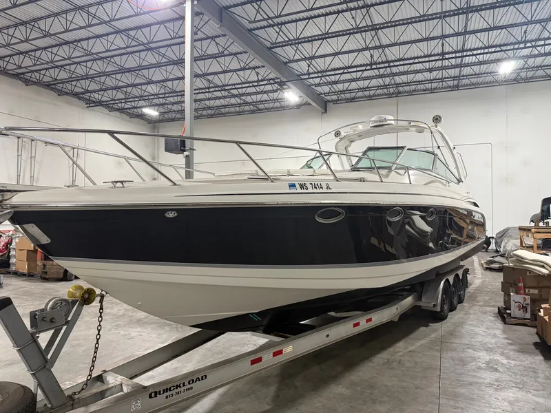 Slide: The Image of 2005 Formula 370 Super Sport boat in warehouse on trailer. - 14