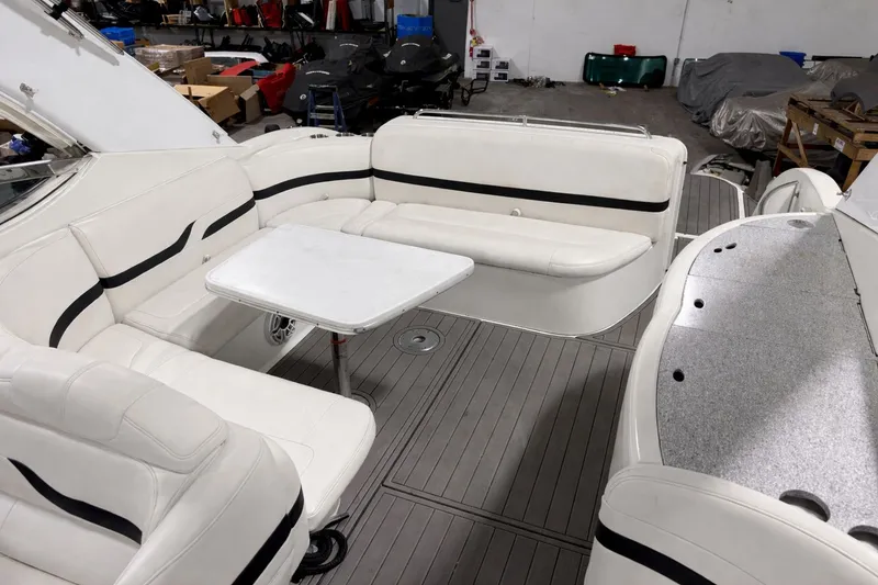 Slide: The Image of Interior of a 2005 Formula 370 Super Sport boat with white seating. - 17
