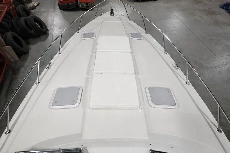 Slide: The Image of Deck of a 2005 Formula 370 Super Sport boat in a storage facility. - 19