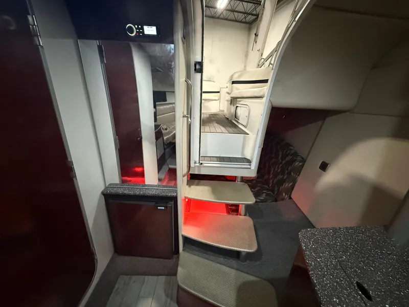 Slide: The Image of Interior of a 2005 Formula 370 Super Sport yacht with stairs and seating area. - 30