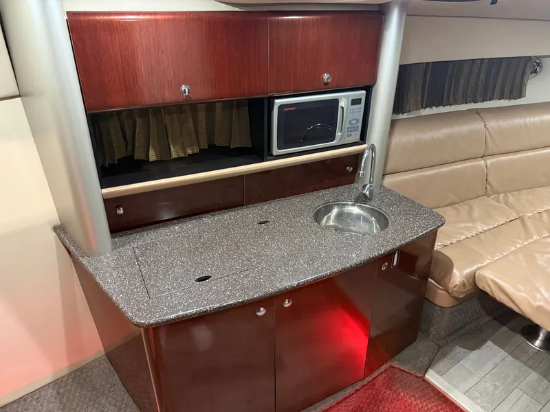 Slide: The Image of 2005 Formula 370 Super Sport interior with kitchenette and seating area. - 31