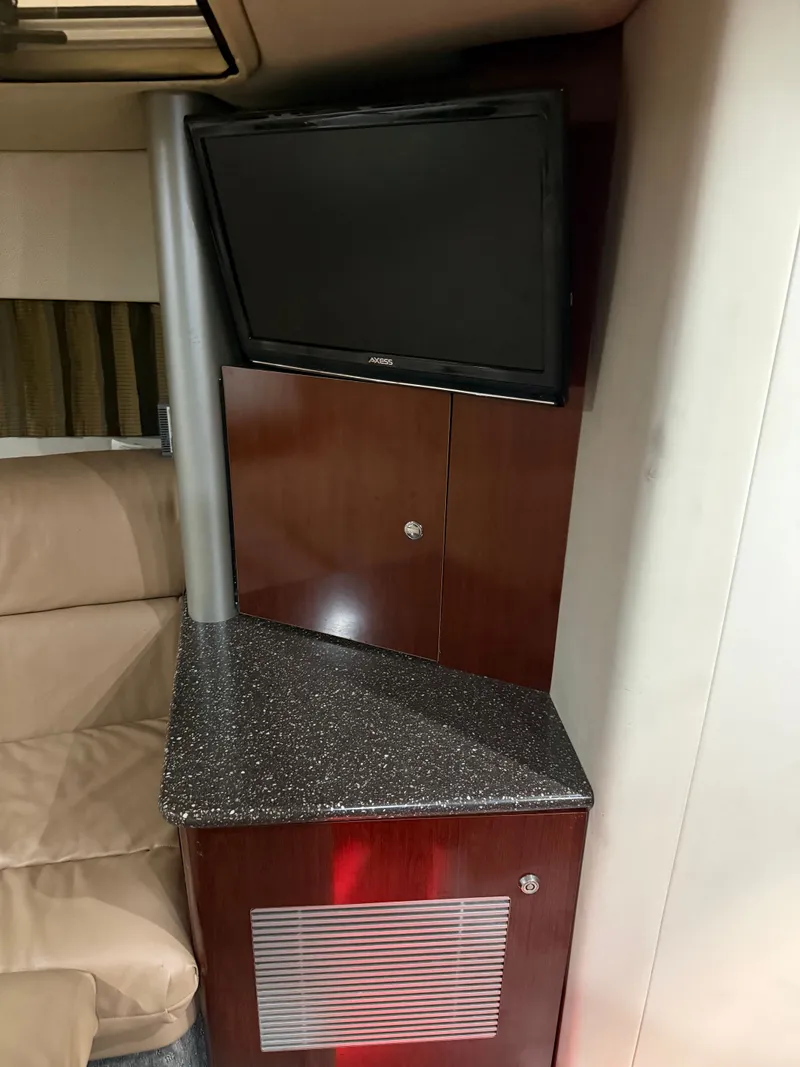 Slide: The Image of Interior of a 2005 Formula 370 Super Sport with TV and seating area. - 32