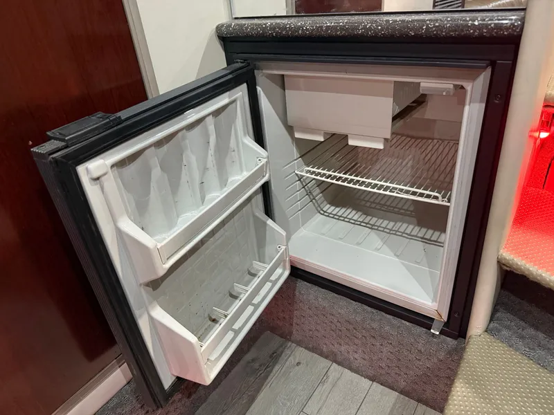 Slide: The Image of Open refrigerator in a 2005 Formula 370 Super Sport yacht. - 36