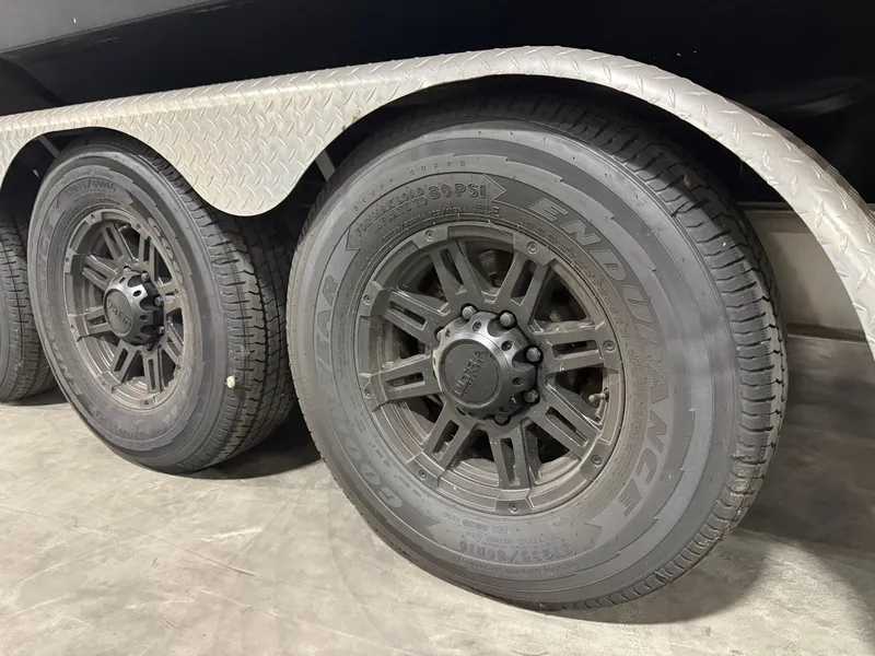 Slide: The Image of Close-up of trailer wheels for a 2005 Formula 370 Super Sport boat. - 39