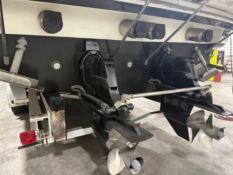 Slide: The Image of Rear view of a 2005 Formula 370 Super Sport boat with dual engines. - 44