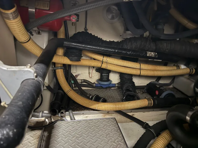 Slide: The Image of Engine compartment of 2005 Formula 370 Super Sport boat with hoses and cables. - 47