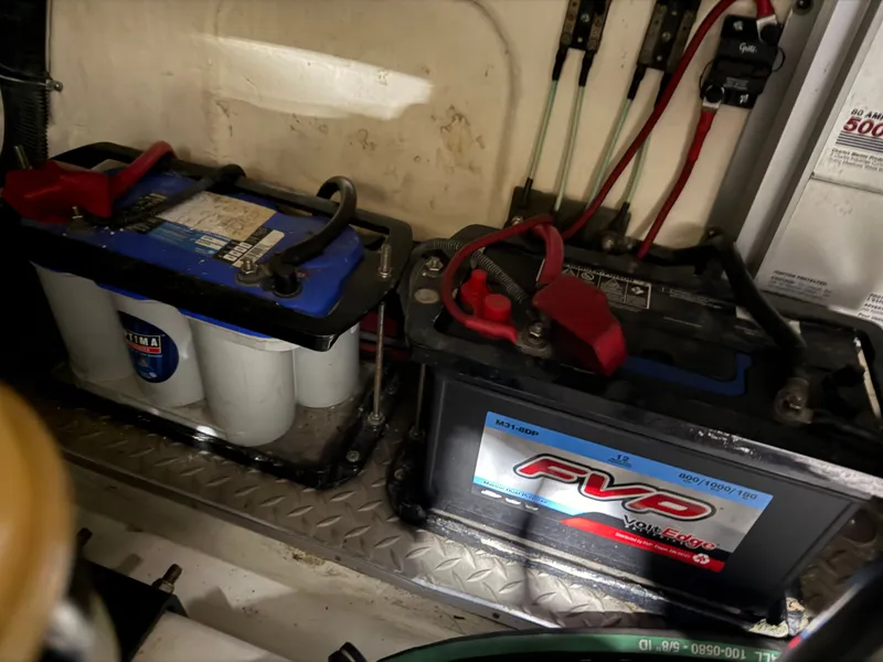 Slide: The Image of Boat batteries in the engine compartment of a 2005 Formula 370 Super Sport. - 48