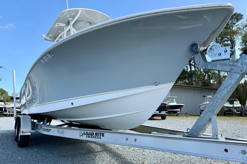 Slide: The Image of 2022 Sea Hunt Ultra 229 boat on trailer in outdoor lot. - 10