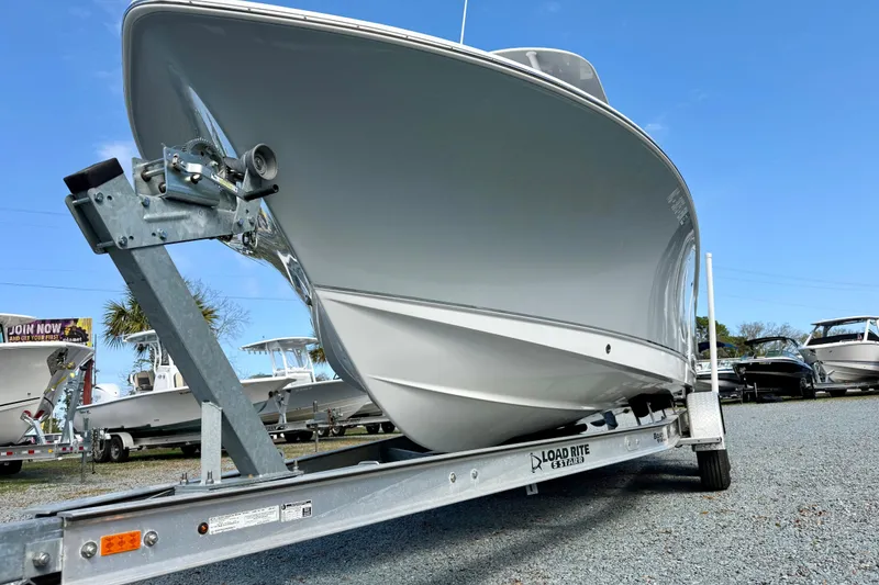 Slide: The Image of 2022 Sea Hunt Ultra 229 boat with spacious deck and modern console. - 12