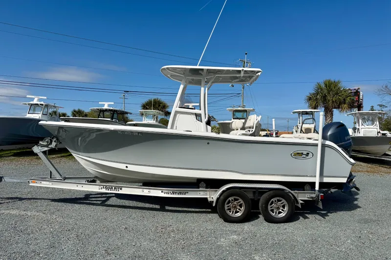 Slide: The Image of 2022 Sea Hunt Ultra 229 boat with Yamaha 200 engine on trailer. - 2