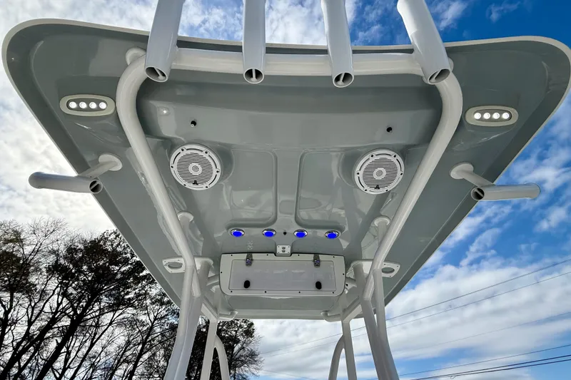 Slide: The Image of 2022 Sea Hunt Ultra 229 boat dashboard with steering wheel and navigation controls. - 24