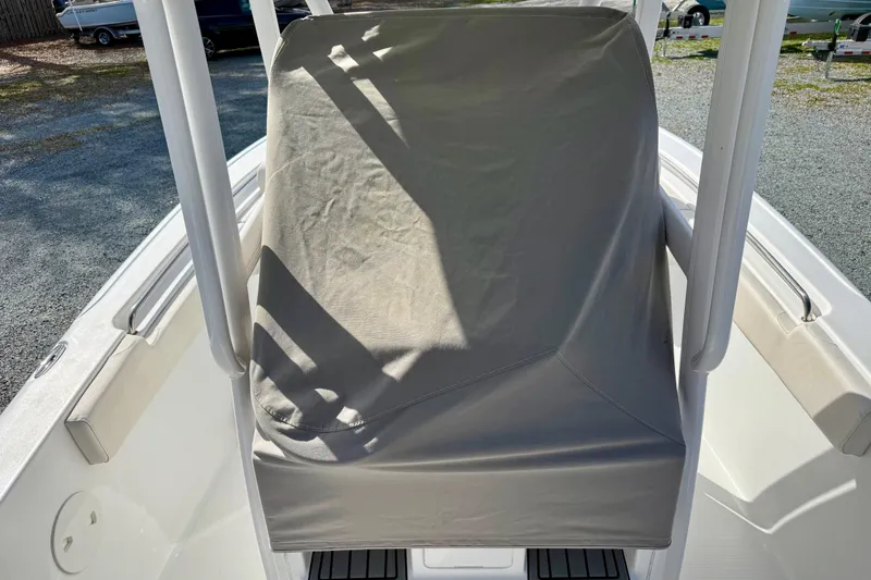 Slide: The Image of Control panel of 2022 Sea Hunt Ultra 229 boat with navigation display and steering wheel. - 26