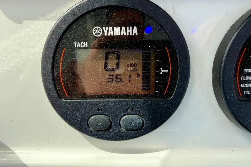 Slide: The Image of JL Audio MediaMaster 50 displaying FM 107.5 on a 2022 Sea Hunt Ultra 229 boat. - 28