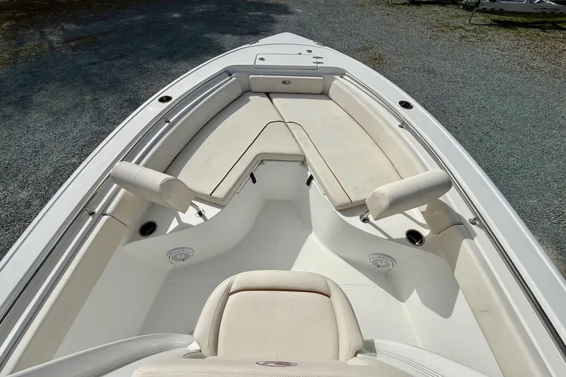 Slide: The Image of 2022 Sea Hunt Ultra 229 boat interior with cushioned seating and sleek design. - 34