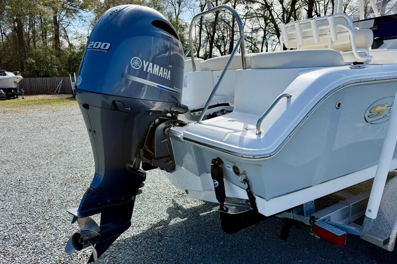 Slide: The Image of 2022 Sea Hunt Ultra 229 boat with Yamaha outboard motor on trailer. - 6