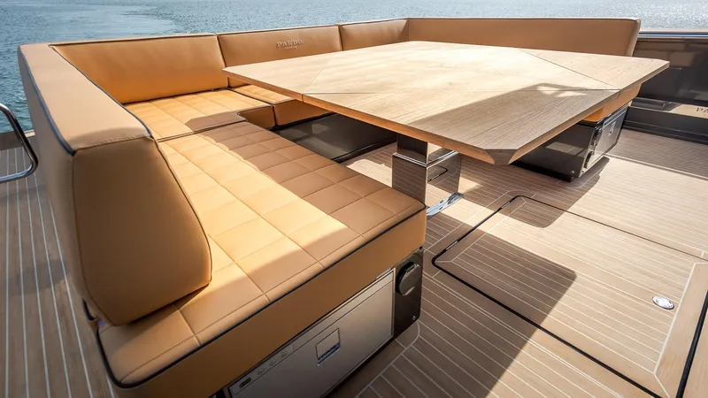 Slide: The Image of Luxurious seating area on 2022 Pardo Yachts 50 with elegant wood table. - 17