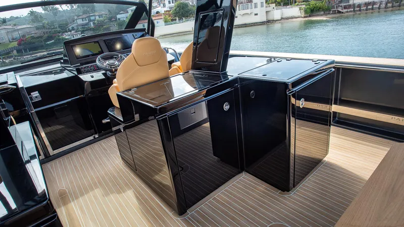 Slide: The Image of Luxurious interior of 2022 Pardo Yachts 50 with sleek black cabinetry and tan seating. - 31
