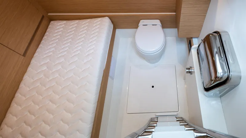 Slide: The Image of Pardo Yachts 50 (2022) interior with bed and toilet in compact cabin space. - 38