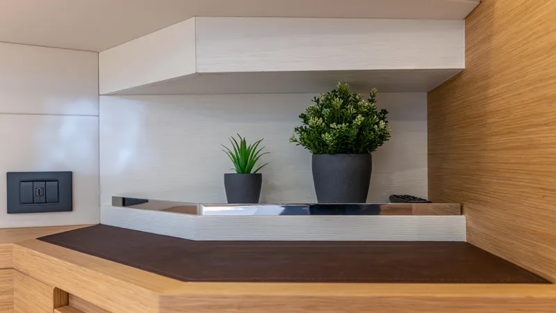 Slide: The Image of Modern interior of 2022 Pardo Yachts 50 with decorative plants on a wooden shelf. - 44