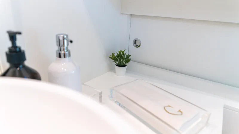 Slide: The Image of Elegant bathroom interior of 2022 Pardo Yachts 50 with soap dispensers and plant. - 47