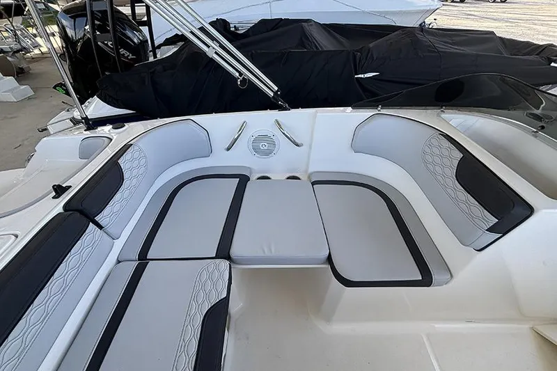 Slide: The Image of 2024 Bayliner Element M17 boat interior with cushioned seating and speaker system. - 10