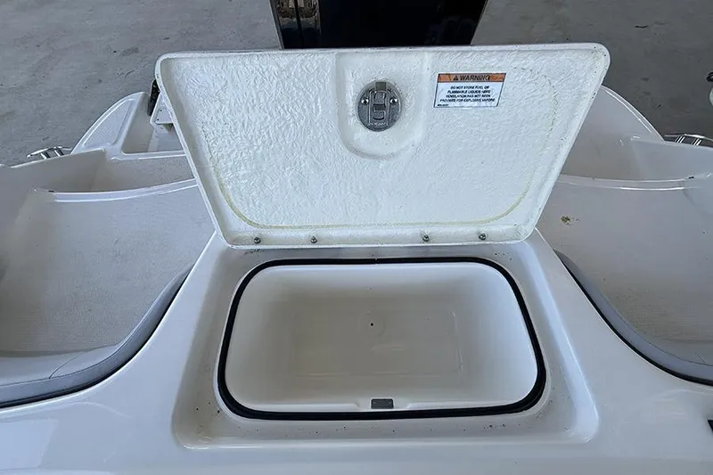 Slide: The Image of Open storage compartment on 2024 Bayliner Element M17 boat. - 13