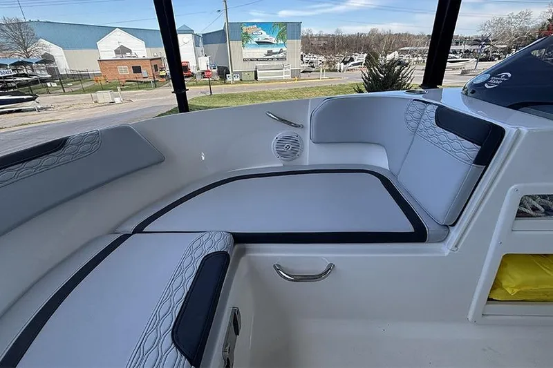 Slide: The Image of 2024 Bayliner Element M17 boat interior with cushioned seating and modern design. - 23