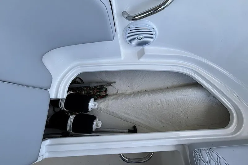 Slide: The Image of Storage compartment in 2024 Bayliner Element M17 boat with fenders and ropes. - 25