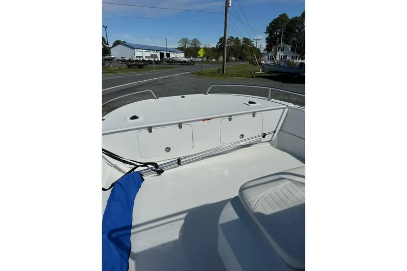 Slide: The Image of 2009 Triumph 1700 Skiff boat deck with storage compartments and seating. - 5