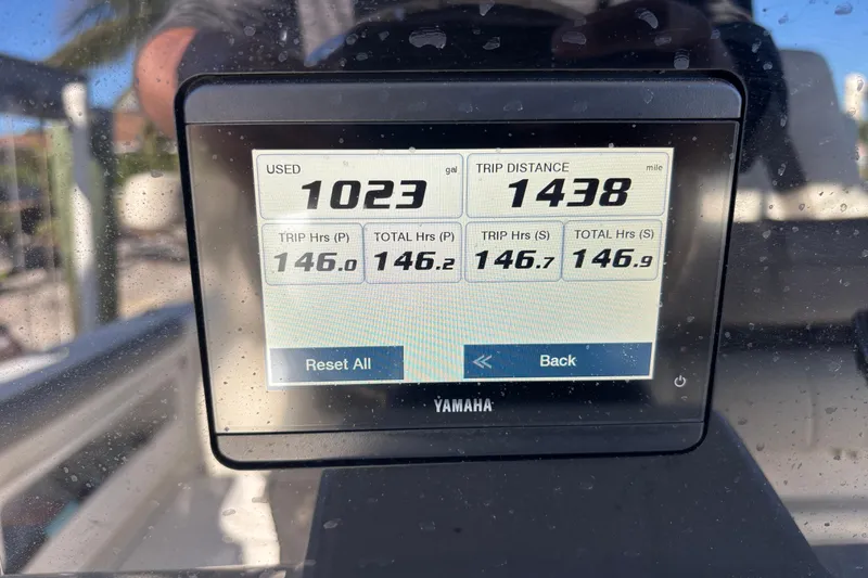 Slide: The Image of Yamaha display showing fuel usage and trip distance on 2023 World Cat 295 CC boat. - 14