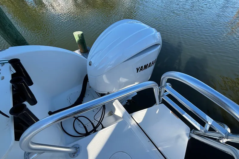 Slide: The Image of 2023 World Cat 295 CC boat with Yamaha outboard engine on calm water. - 21