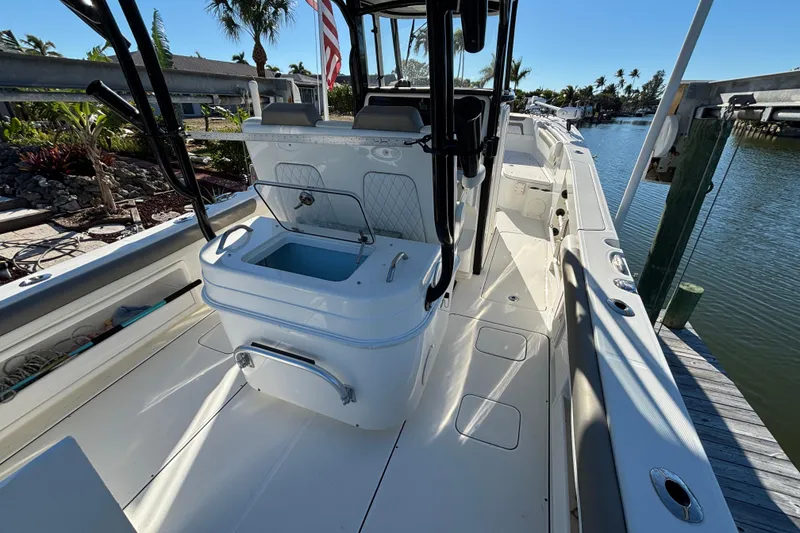 Slide: The Image of 2023 World Cat 295 CC boat interior with open deck and seating area. - 8
