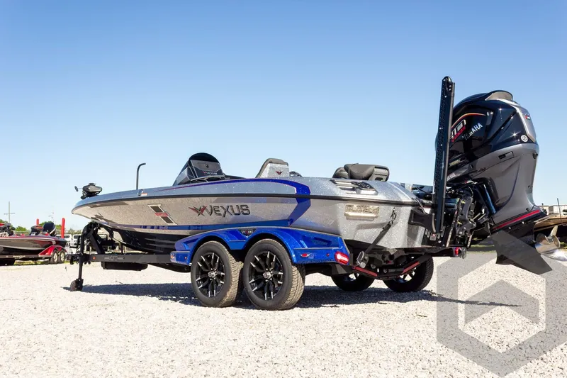 Slide: The Image of 2026 Vexus VXs21 boat on trailer, featuring sleek design and powerful outboard motor. - 11