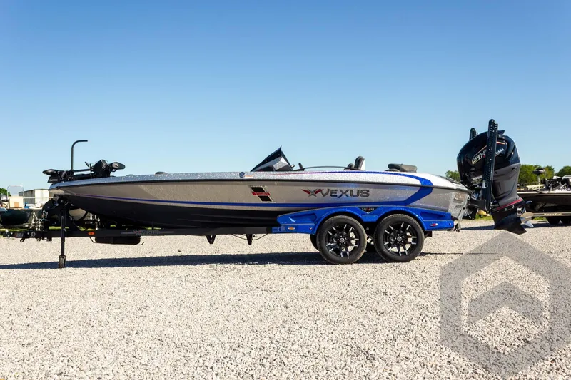 Slide: The Image of 2026 Vexus VXs21 boat on trailer, side view, parked on gravel. - 12