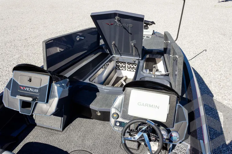 Slide: The Image of 2026 Vexus VXs21 boat interior with Garmin navigation system and storage compartments. - 14