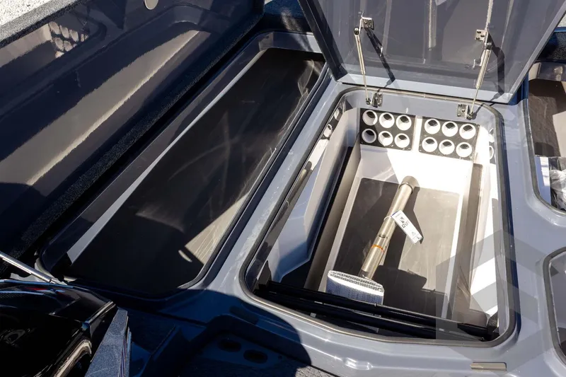 Slide: The Image of 2026 Vexus VXs21 boat storage compartments with open lids, showcasing spacious interior design. - 15