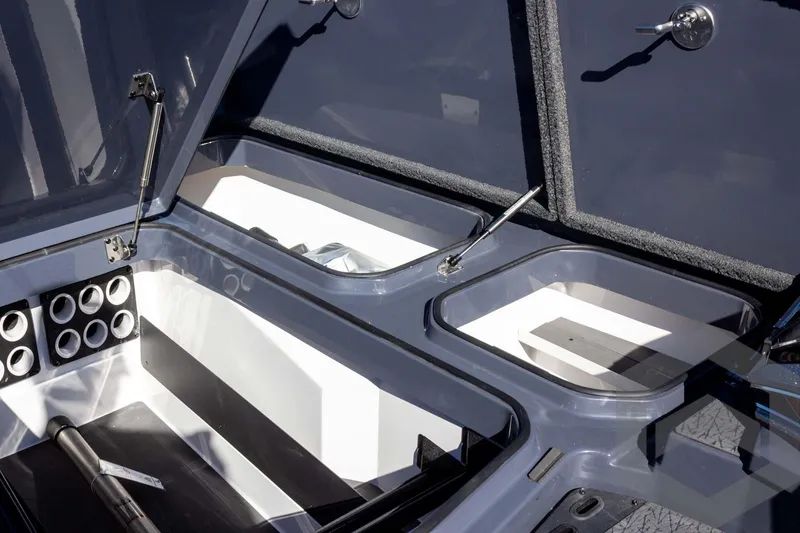 Slide: The Image of Interior storage compartments of 2026 Vexus VXs21 boat, featuring organized layout and modern design. - 16