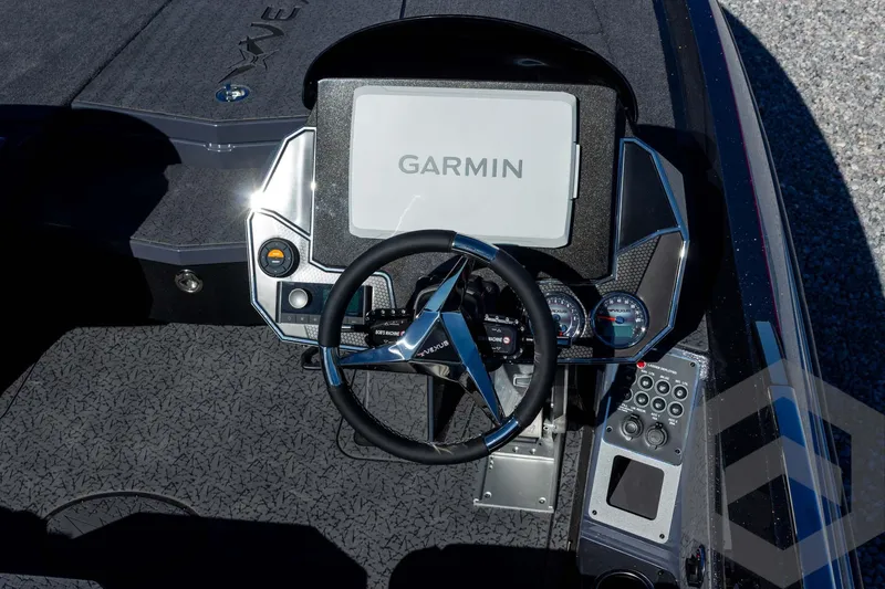 Slide: The Image of 2026 Vexus VXs21 boat dashboard with Garmin display and steering wheel. - 21