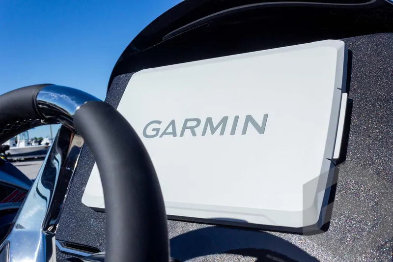 Slide: The Image of Steering wheel and Garmin display on 2026 Vexus VXs21 boat dashboard. - 23