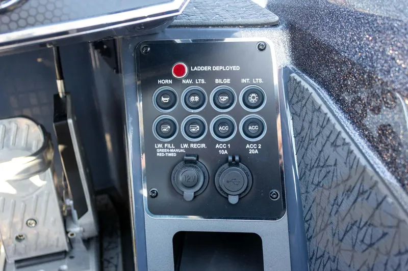 Slide: The Image of Control panel of 2026 Vexus VXs21 boat with various switches and sockets. - 26
